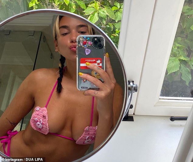 Sexy: Dua Lipa, 24, proudly flaunted her jaw-dropping figure in a barely-there pink bikini as she shared even more racy snaps during lockdown