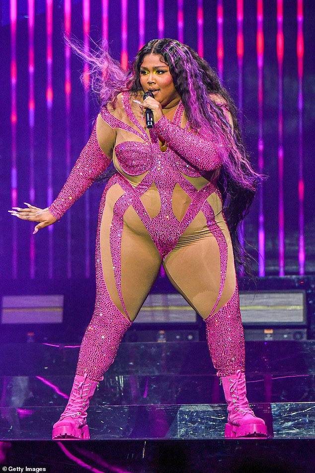 H๏τ stuff: Lizzo displayed her curves in a sparkly pink body stocking as she stormed the stage at Little Caesars Arena in Detroit, Michigan on Thursday