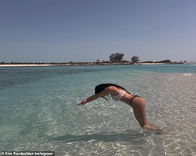 Kim Kardashian posted a gallery of photos on Instagram on Wednesday from her Turks and Caicos vacation including one of her inexplicably diving into knee-deep water