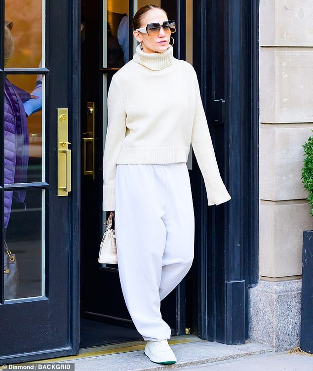 Jennifer Lopez, 54, stunned in an all-white outfit complete with a 2,000 Himalaya Birkin bag in NYC on Wednesday after announcing the release date of her new film's trailer